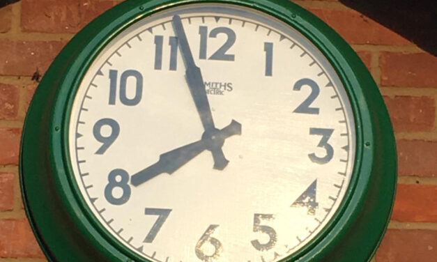 Club legend fixes the clock!
