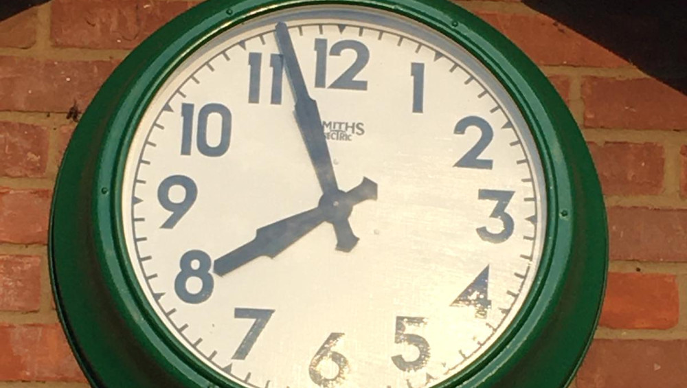 Club legend fixes the clock!